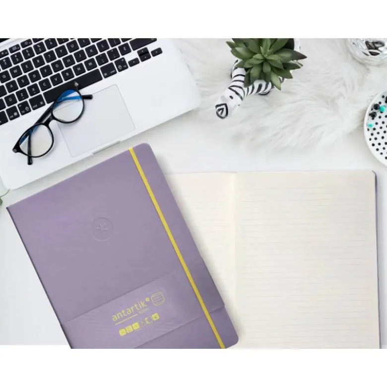 CUADERNO CON GOMILLA ANTARTIK NOTES TAPA DURA A4 HOJAS RAYAS MORADO Y AMARILLO 100 HOJAS 80 GR FSC