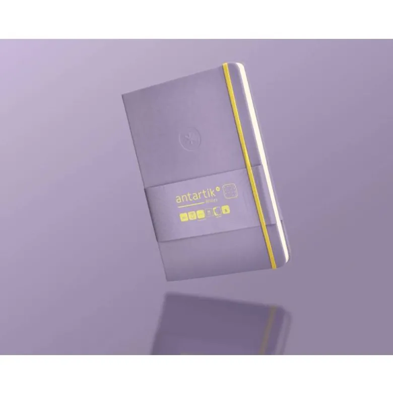 CUADERNO CON GOMILLA ANTARTIK NOTES TAPA DURA A5 HOJAS PUNTOS MORADO Y AMARILLO 100 HOJAS 80 GR FSC