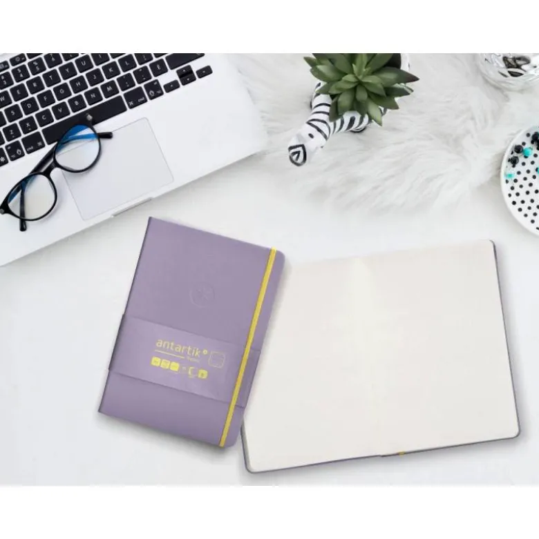 CUADERNO CON GOMILLA ANTARTIK NOTES TAPA DURA A5 HOJAS PUNTOS MORADO Y AMARILLO 100 HOJAS 80 GR FSC
