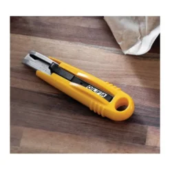 Cuter plastico Olfa cuchilla 18 mm retractil para zurdos